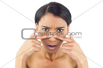 Gorgeous woman pressing her nose
