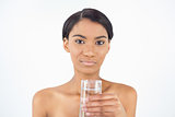 Peaceful attractive model holding glass of water
