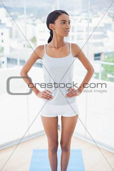 Pensive gorgeous model in sportswear posing