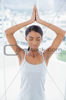 Relaxed gorgeous model doing yoga exercise