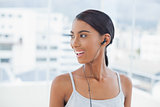 Smiling pretty model listening to music