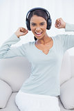 Attractive woman dancing while listening to music
