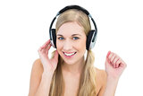 Pretty young blonde woman enjoying music