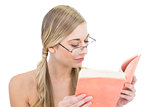 Peaceful young blonde woman reading a book