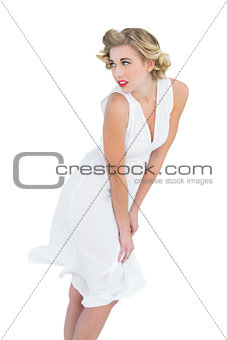 Thoughtful fashion blonde model posing looking away