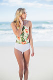 Thoughtful blonde model in swimsuit posing looking away