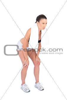 Competitive fit model in sportswear holding sport towel