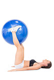 Smiling athletic woman working out with exercise ball