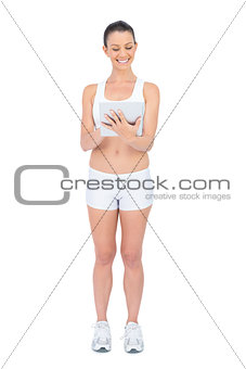 Cheerful fit woman using tablet