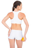 Rear view of fit woman suffering from painful pelvis
