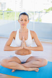 Relaxed woman in yoga position