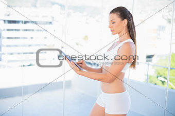 Sporty woman using tablet
