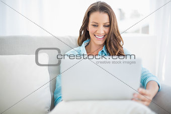 Happy pretty woman using laptop