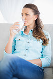 Calm woman drinking water