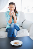 Peaceful woman enjoying her coffee
