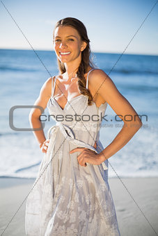 Smiling attractive woman in summer dress posing
