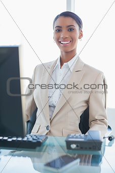 Smiling gorgeous businesswoman posing