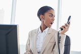 Furious gorgeous businesswoman shouting on the phone