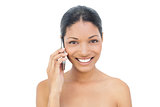 Smiling black haired model on the phone