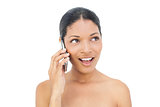 Cheerful black haired model on the phone
