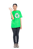 Black haired model wearing recycling tshirt making okay gesture