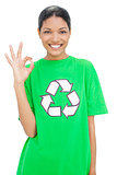 Happy model wearing recycling tshirt making okay gesture