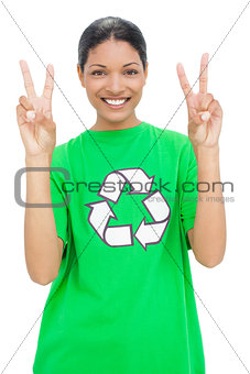 Happy model wearing recycling tshirt making peaceful gesture