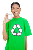 Happy model wearing recycling tshirt holding pot