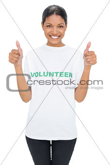 Smiling model wearing volunteer tshirt giving thumbs up