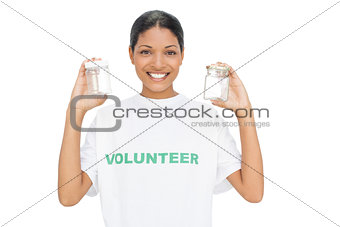 Smiling model wearing volunteer tshirt holding pots