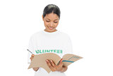 Cheerful model wearing volunteer tshirt writing