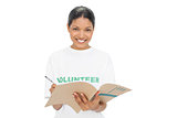 Smiling model wearing volunteer tshirt writing