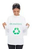 Happy model wearing volunteer tshirt holding recycling box