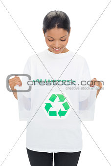 Happy model wearing volunteer tshirt holding recycling box