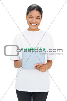 Happy model wearing volunteer tshirt holding tablet