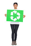 Volunteer young woman holding recycling sign