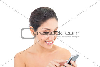 Attractive brunette using a smartphone