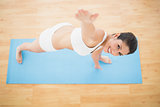 Fit woman stretching in extended side angle pose