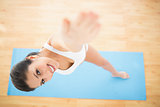 Happy woman stretching in extended side angle pose