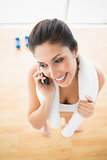 Fit woman on the phone taking a break