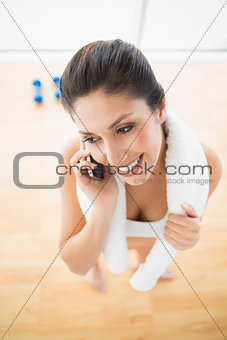 Fit woman on the phone taking a break