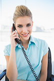 Smiling stylish businesswoman on the phone