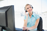 Thoughtful call centre agent working on computer