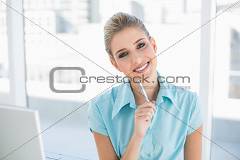 Smiling smart businesswoman posing
