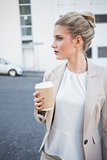 Peaceful stylish businesswoman holding coffee