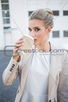 Gorgeous stylish businesswoman drinking coffee
