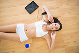 Fit smiling woman doing sit ups