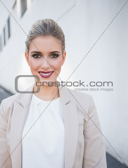 Cheerful attractive businesswoman posing