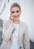 Cheerful attractive businesswoman on the phone