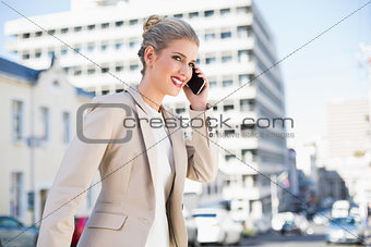 Cheerful gorgeous businesswoman having a phone call